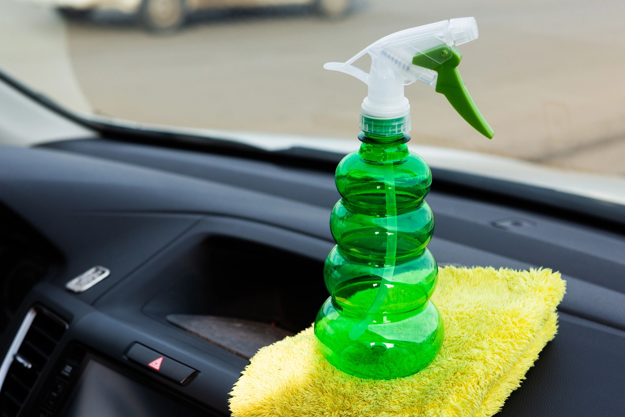 Car cleaning detail with microfiber cloth.