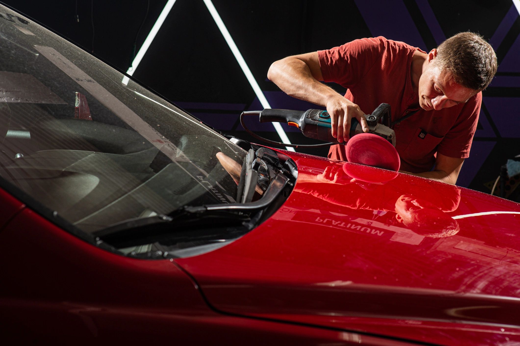 Car paint polishing during detailing service